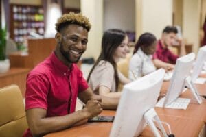 smiling-man-computer-class-skills-development-create-infinity-2023